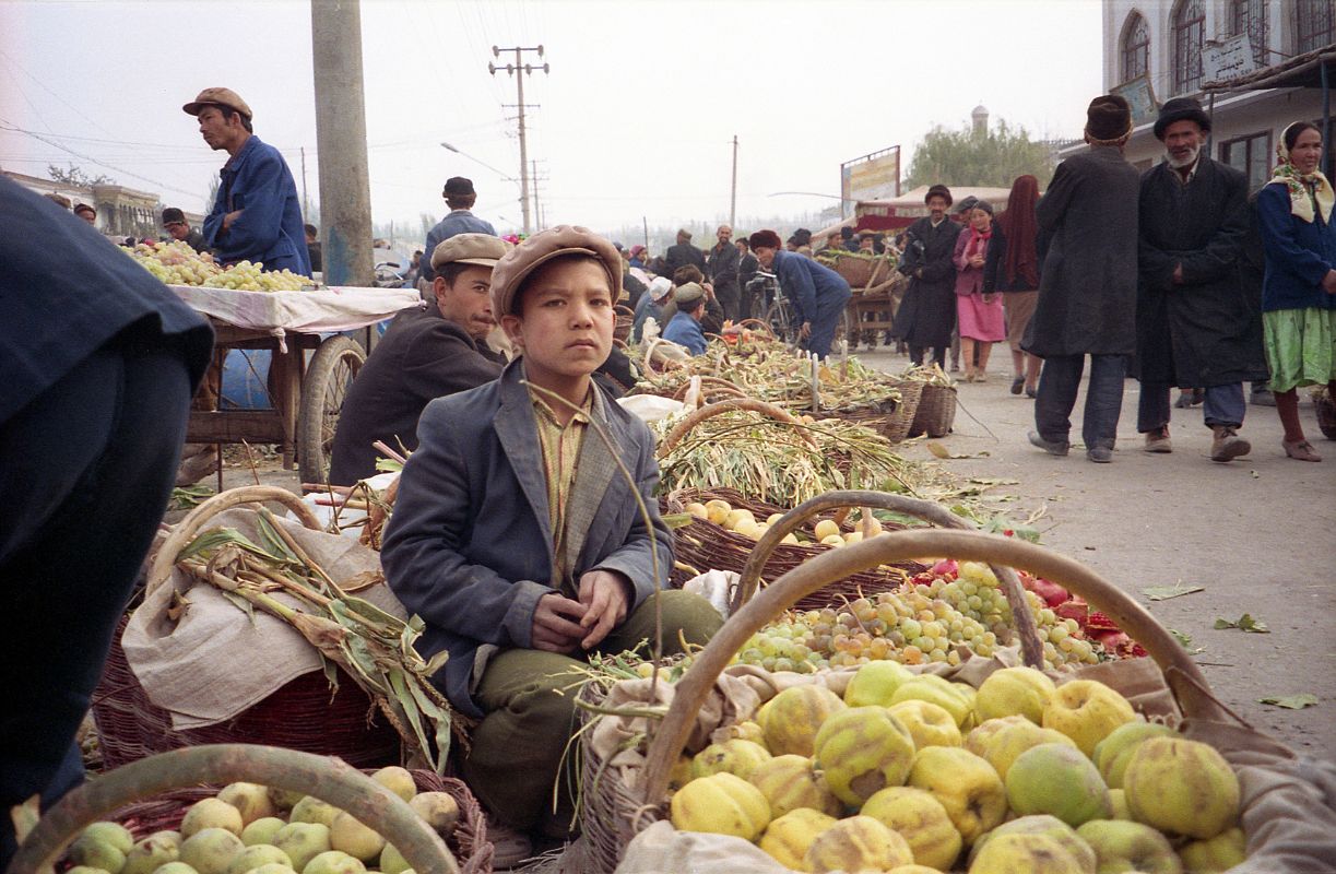 42 Kashgar Sunday Market 1993 Young Boy Selling Vegetables